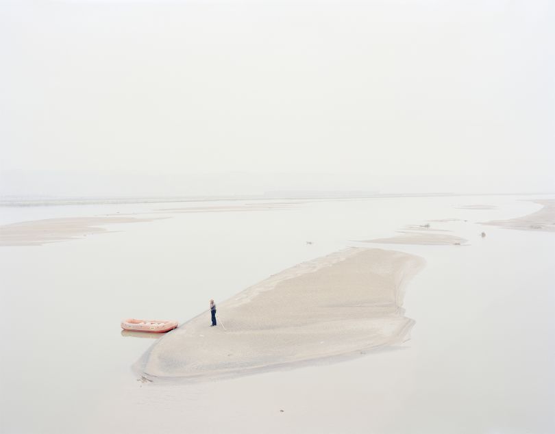 A man standing on an island in the middle of the river, Shaanxi, China, 2011 © Zhang Kechun