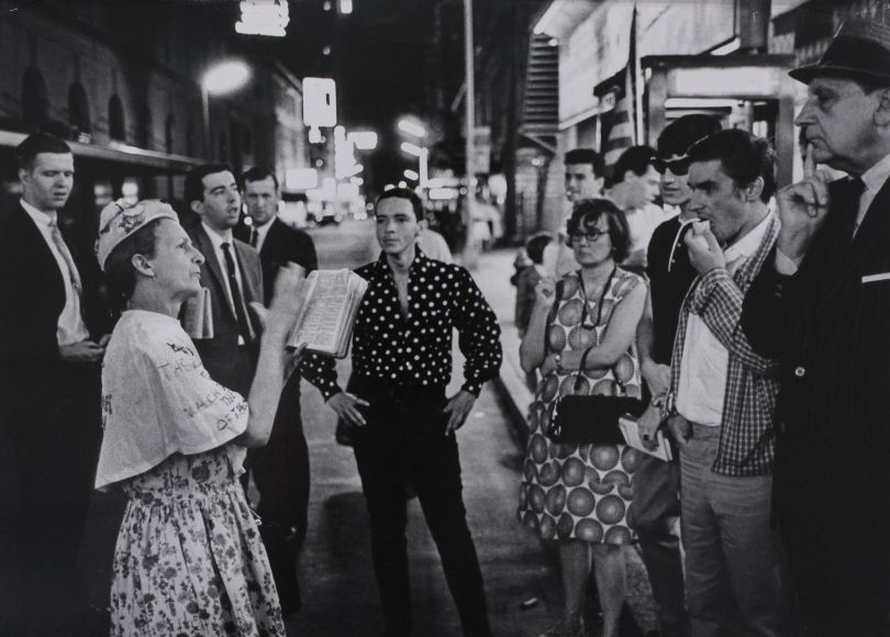 Street Corner Evangelist “Rosie” Preaching at Broadway & 45th Street, New York City, 1966 © Garry Winogrand courtesy Huxley-Parlour Gallery