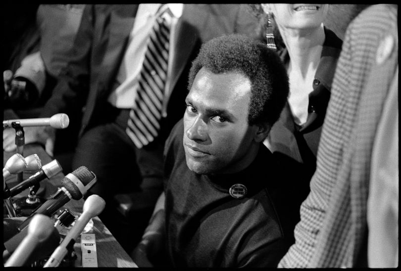 Huey P. Newton Black Panther Party Minister of Defense, speaking to the media upon his release from prison on August 5th, 1970, at the offices of his attorney, Charles R. Garry. From, “The Lost Negatives,” photographs by Jeffrey Henson Scales. Credit: Jeffrey Henson Scales