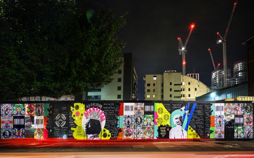 'We Are One Family' mural on Freston Road section at night by Azarra Amoy & Linett Kamala - Photo credit Edwin Ingram