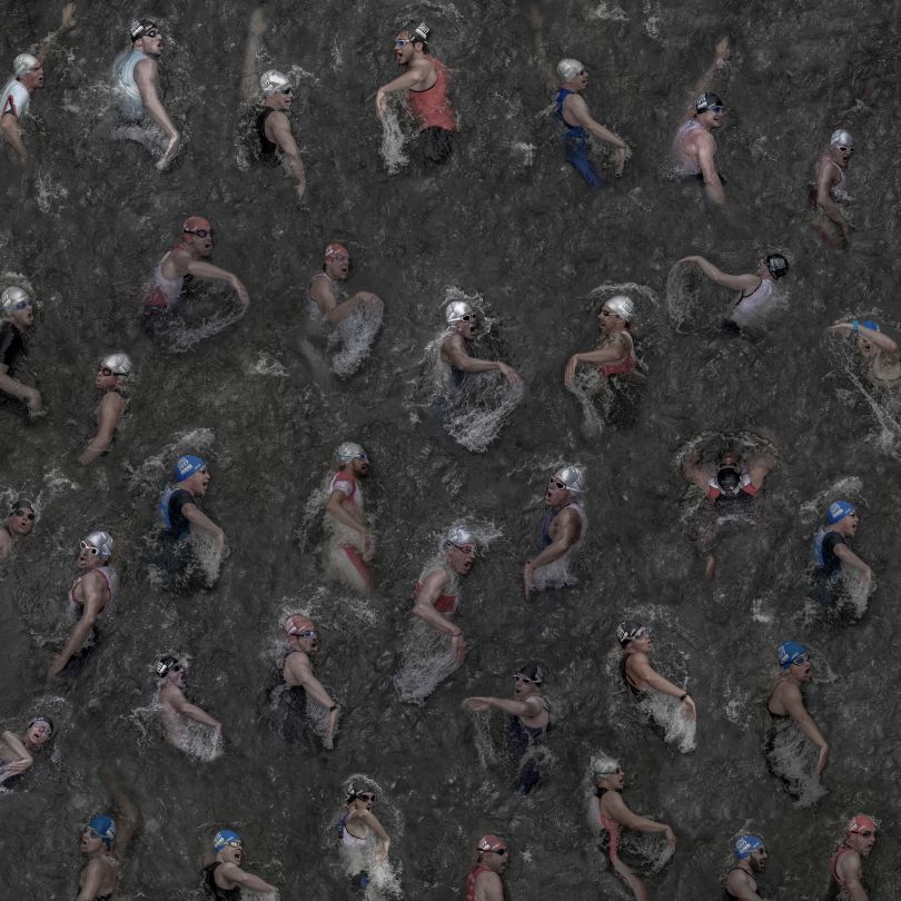 The picture was taken in summer  2017 from 35 individual  images of swimmers at the triathlon in the Duesseldorf Media Harbor. I was able to take a picture of them from above, while the athletes crossed a pedestrian bridge capturing their very individual 
