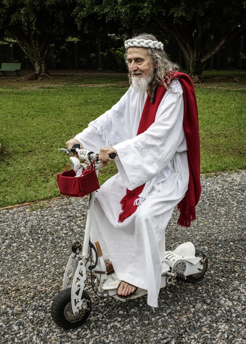 INRI Cristo, rides a bike around his compound outside of Brasilia, known as The New Jerusalem. INRI are the initials that Pontius Pilate had written on top of Jesus' cross. Brazil, 2014 | © Jonas Bendiksen/ Magnum Photos