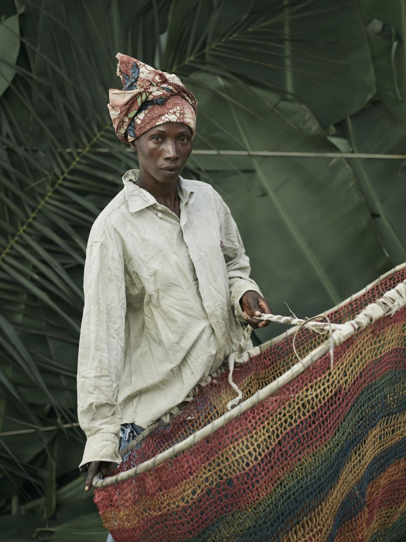 Massa Kennie, holding home-made hooped nets used for fishing, in the village of Tombohuaun, Kailahun District, Sierra Leone, May 2017. WaterAid/ Joey Lawrence