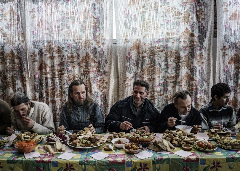 Communal feast during an all-day pilgrimage march for Vissarion's birthday on January 14th. This date is known as the true Christmas to his followers. Russia, 2015 | © Jonas Bendiksen/ Magnum Photos