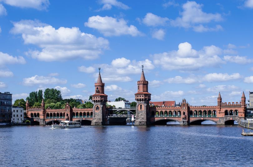 Berlin on the oberbaumbruecke in the most beautiful summer weather. Image licensed via Adobe Stock