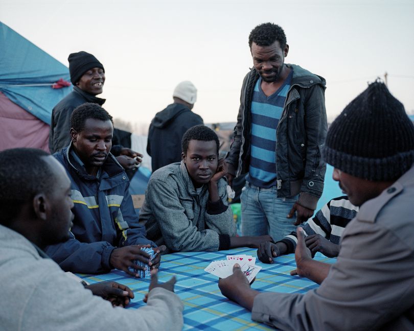 Calais, France, November 2015 Sudanese men playing cards