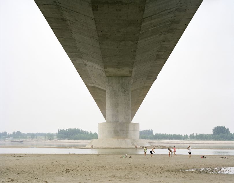 A family spending a weekend under a bridge, Shandong, China, 2011 © Zhang Kechun