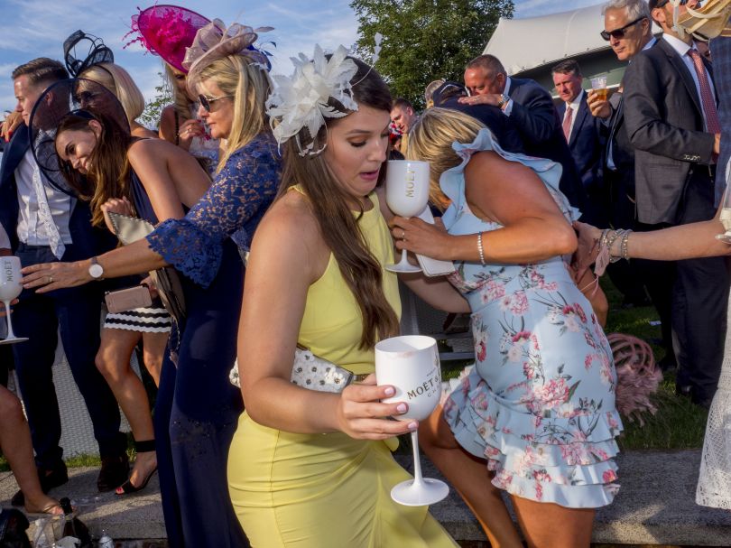 Race goers carry on drinking at the after party on Ladies Day at Epsom. June 2018 © Peter Dench