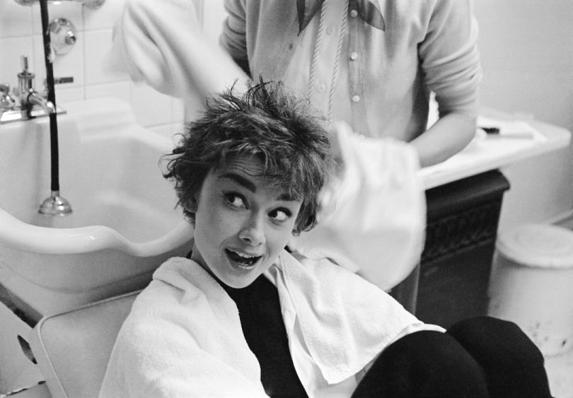 This photograph of Audrey Hepburn being shampooed on the set of ‘Sabrina’ was taken by Mark Shaw for LIFE in 1953. Audrey Hepburn had her hair washed every night while working on the film and often conducted business with her agents while under a drier. Aged 24 at the time, she was already poised to become a huge star and her performance in ‘Sabrina’ was nominated for both a BAFTA and an Academy Award. Audrey Hepburn Being Towel Dried, 1953, Mark Shaw © Mark Shaw / mptvimages.com