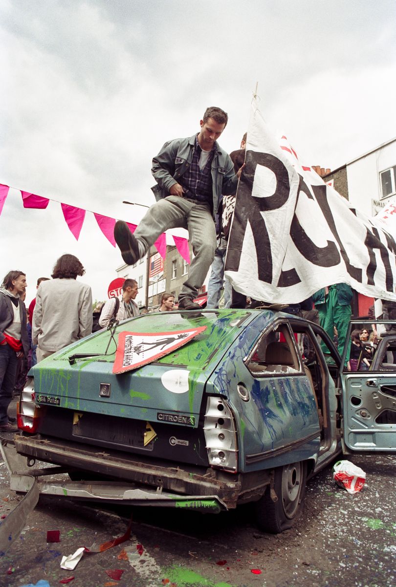 Reclaim the Streets Camden 1995 – After a staged car crash with faux road rage members of RTS get creative with the cars.