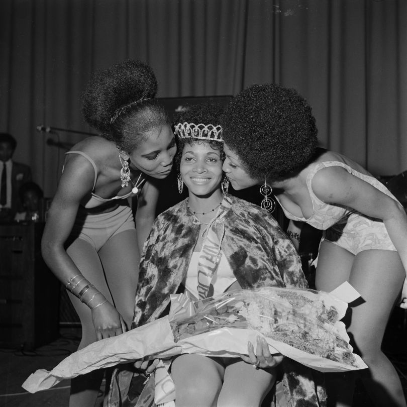 'Miss Black & Beautiful Rhona Williams with fellow contestants, Hammersmith Palais, London, 1970s.                                                                    From the portfolio 'Black Beauty Pageants'.                                          Courtesy of © Raphael Albert/Autograph ABP