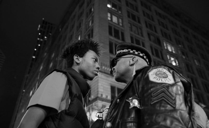 Contemporary Issues, third prize singles: Lamon Reccord stares down a police sergeant during a protest following the fatal shooting of Laquan McDonald by police in Chicago, Illinois, USA. John J. Kim.