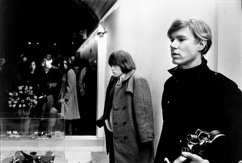 ‘Andy Warhol with Brian Jones’, Paraphernalia Boutique, New York, 1966. © Nat Finkelstein Estate