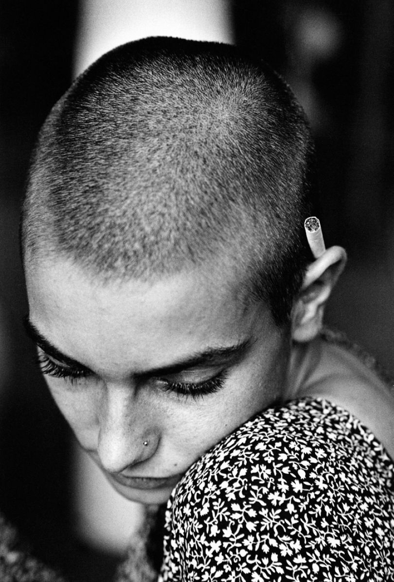 Sinéad O'Connor, 1992 © Jane Bown Estate. Taken during a rehearsal backstage, Jane Bown managed to capture a contemplative, calm photograph of Sinéad O'Connor. During the early 1990s, every other photographer was taking images that featured O'Connor's large beautiful eyes, but Bown’s unique composition in this photograph creates something truly iconic.