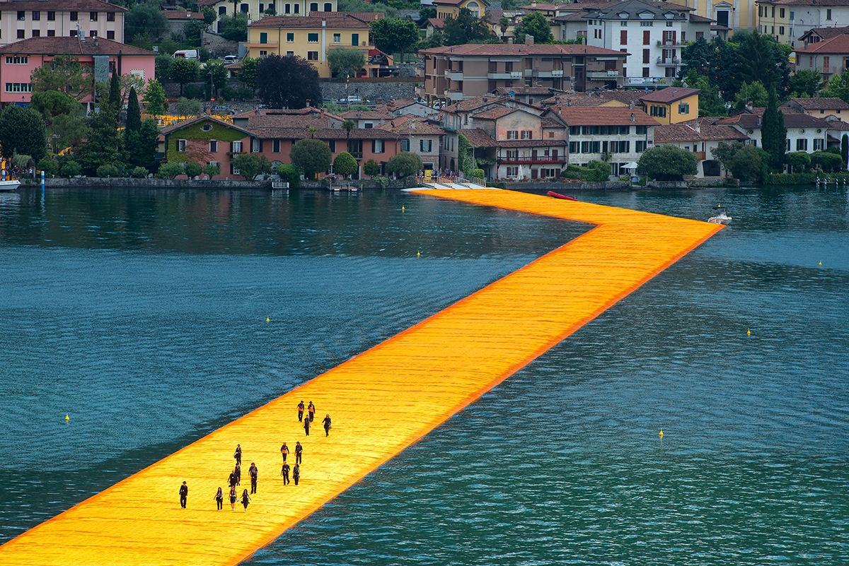The Floating Piers Artist Christo helps people to walk on water in