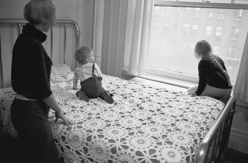 Jenny, Ulrika, and Monika on Swedish grandmother’s bedspread looking out the window toward Broadway at West 89th Street, 1967