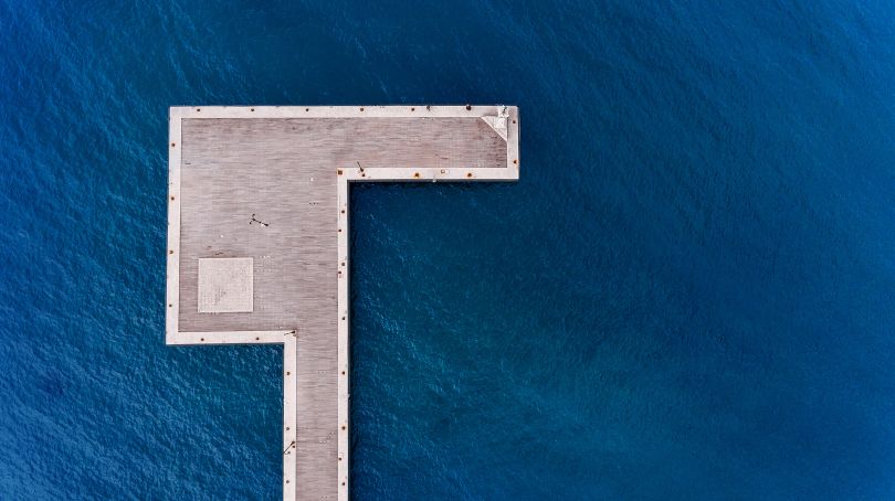 An aerial shot of a dock in Kos island of Greece. The unique shape of the dock from above make me put it, in 1/3 of an aerial frame. The blue sea and the light wood boards makes a very nice and minimal contrast.  Copyright: © Emmanouil Smalios, Greece, Shortlist, Open, Architecture (Open competition), 2018 Sony World Photography Awards