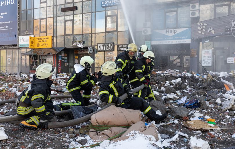 KYIV, UKRAINE - Feb. 25, 2022: War of Russia against Ukraine. Rescue service works near a house destroyed by russian rocket in Kyiv  — Photo by palinchak