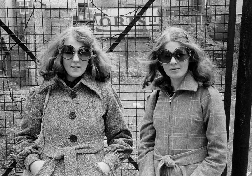 Fashion sisters (sunglasses and platforms), 1973 © Tom Wood courtesy RRB Photobooks