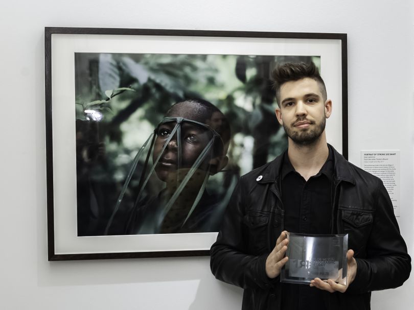 Joint third prize winner Joey Lawrence with his portrait. Photograph by Jorge Herrera