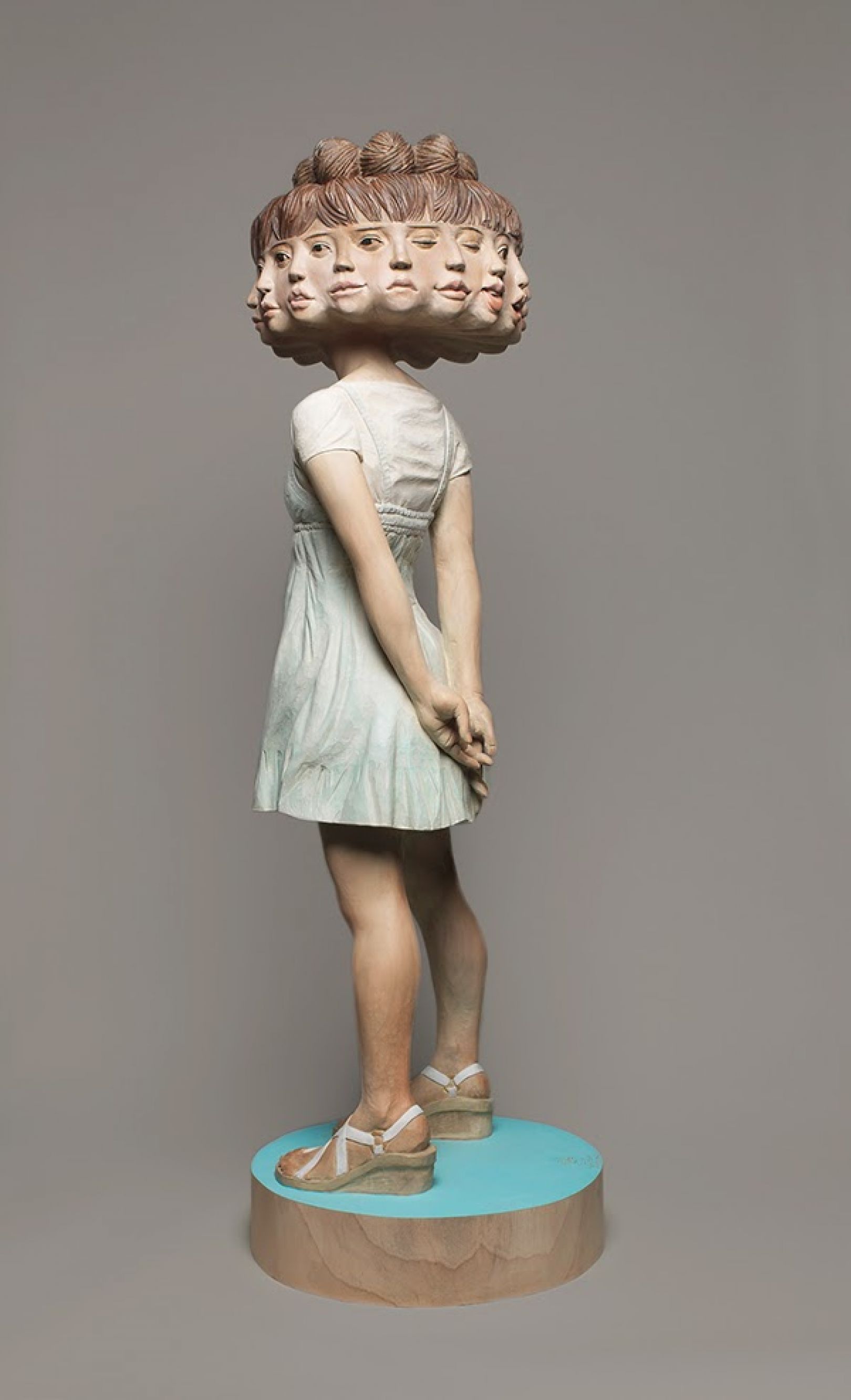Sculptures of women carved from wooden blocks with glitch effects ...