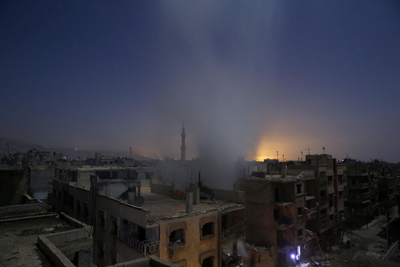 Spot News, first prize stories: Smoke rises from a building following reported shelling by Syrian government forces in Douma, Syria. Sameer Al-Doumy.