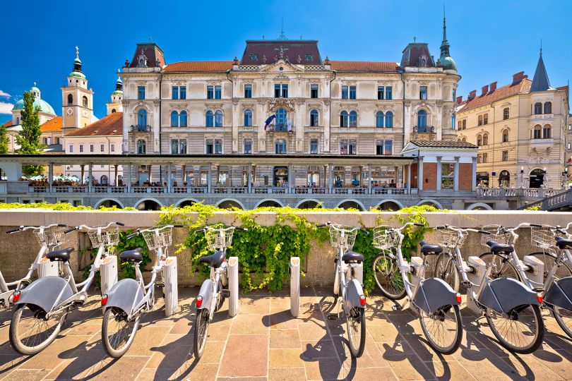 Ljubljana architecture and tourist bikes. Image licensed via Adobe Stock